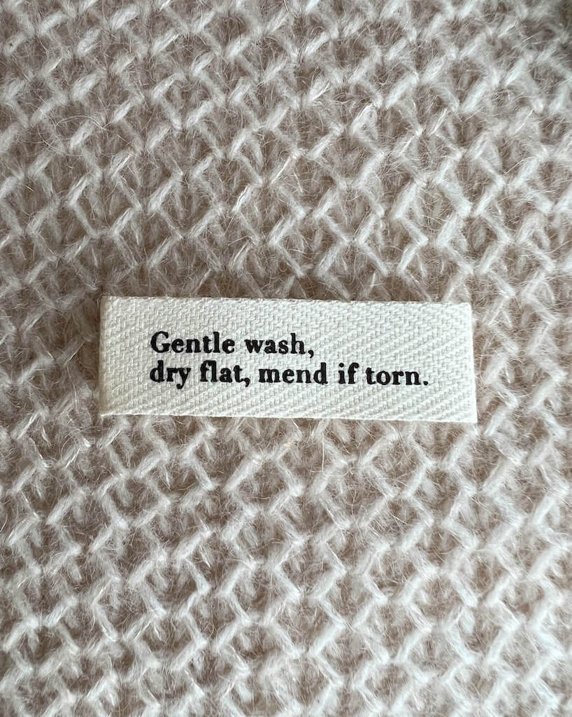 PetiteKnit - "Gentle wash, dry flat, mend if torn." - Label